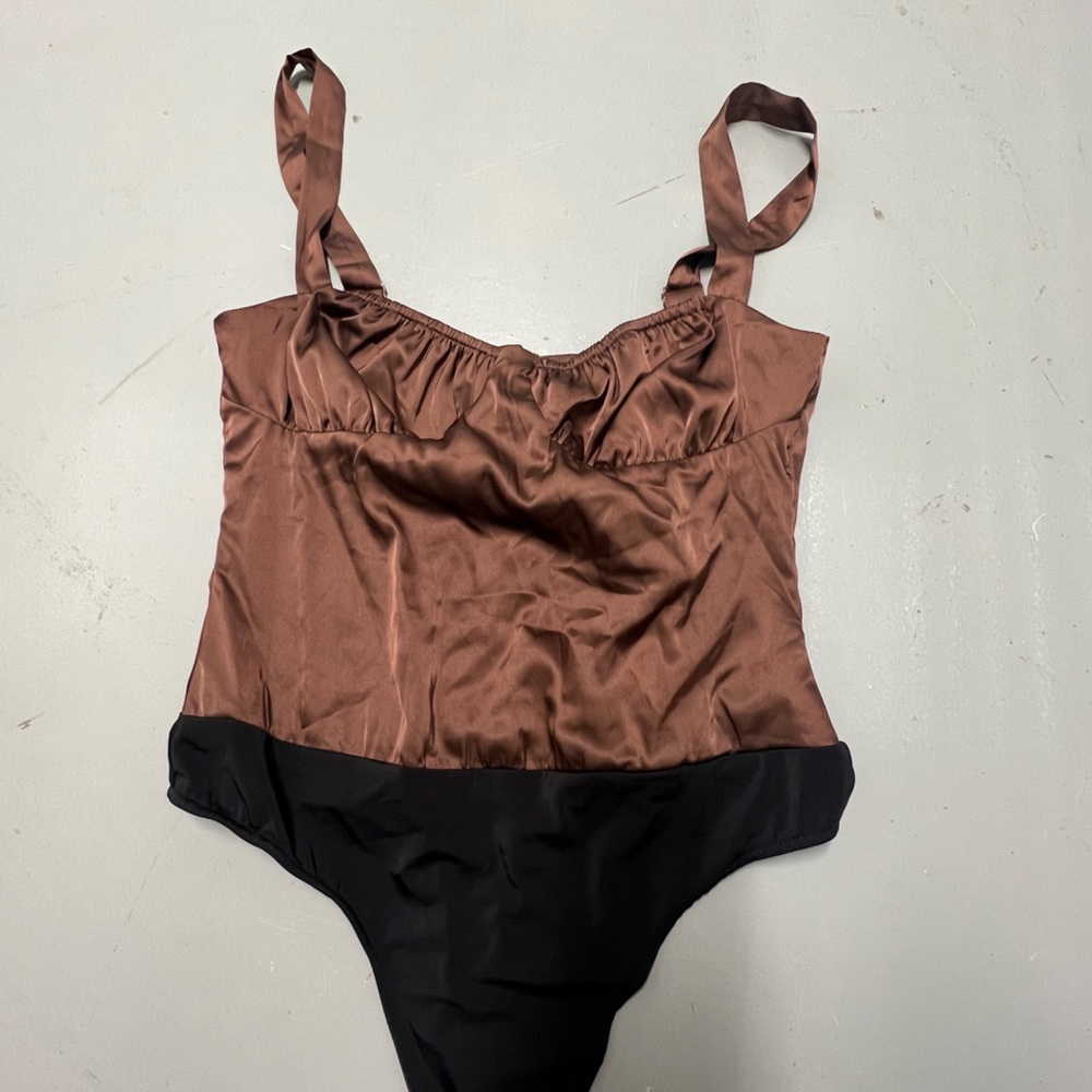 We wore what nwt ruched silky bodysuit brown with black on bottom snaps